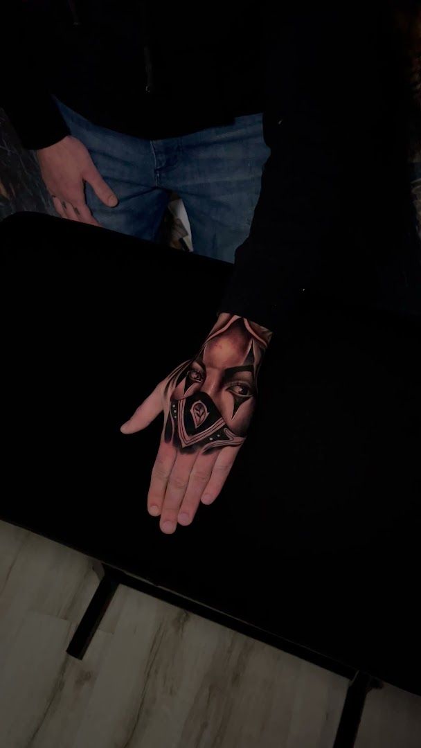 a hand cover-up tattoo with a rose on it, bremen, germany