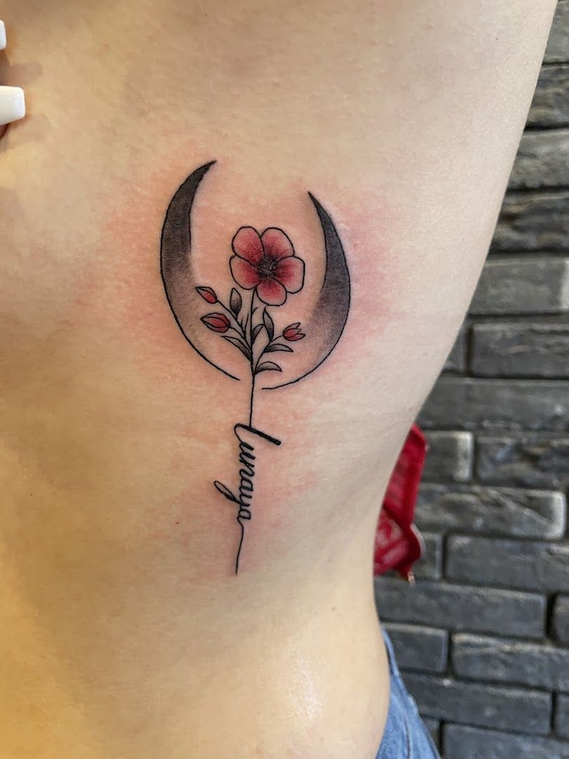 a small narben tattoo with a flower on the side, göttingen, germany