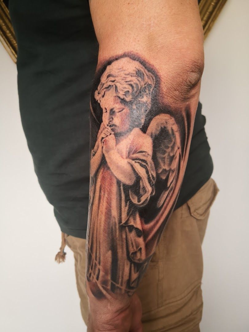 a man with a cover-up tattoo on his arm, amberg-sulzbach, germany