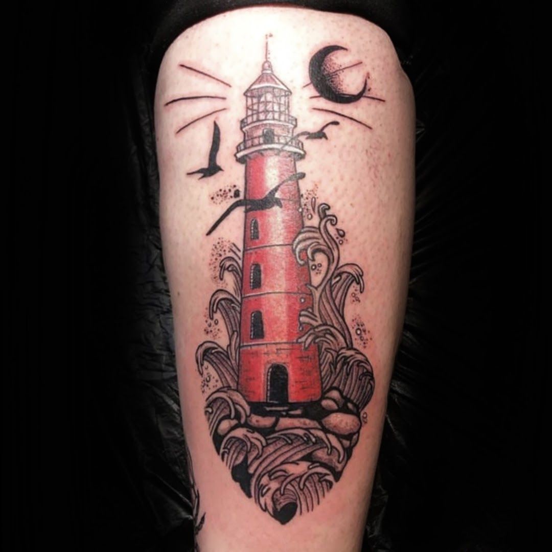 a lighthouse narben tattoo on the arm, schleswig-flensburg, germany