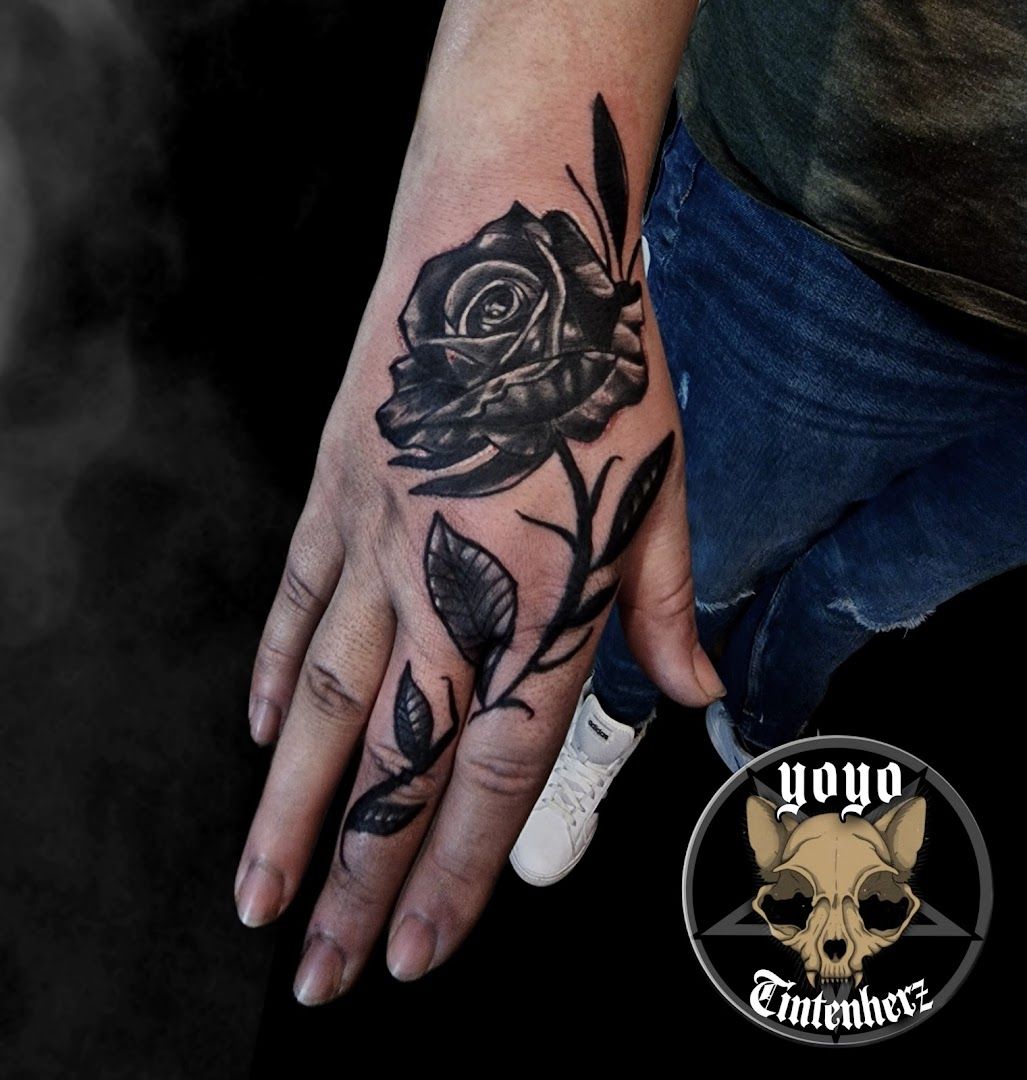 a man's hand with a narben tattoo of a rose on it, bochum, germany