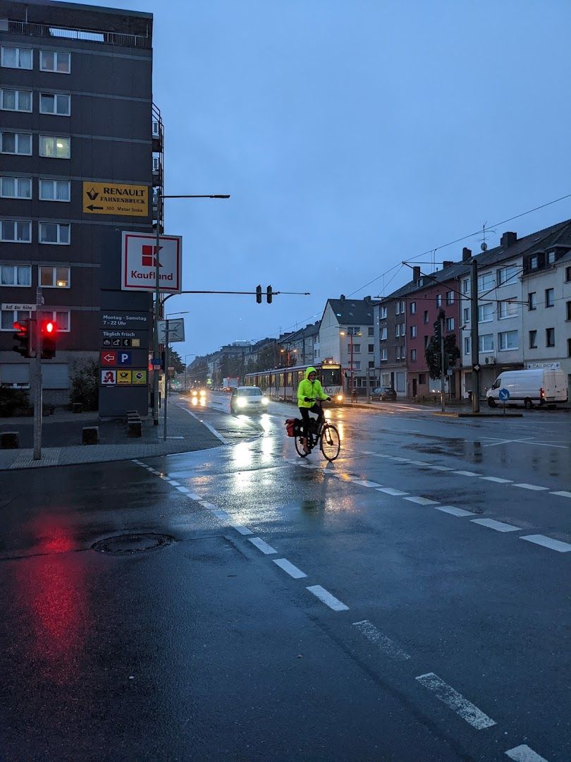 a person riding a bike on a wet street