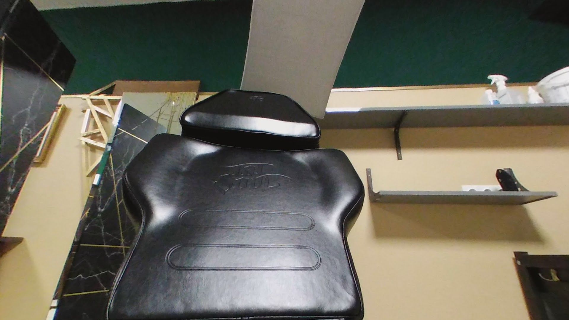 a motorcycle seat with a black seat cover