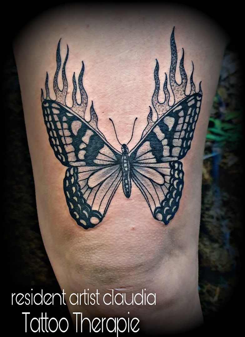 a black and white butterfly narben tattoo on the leg, schleswig-flensburg, germany