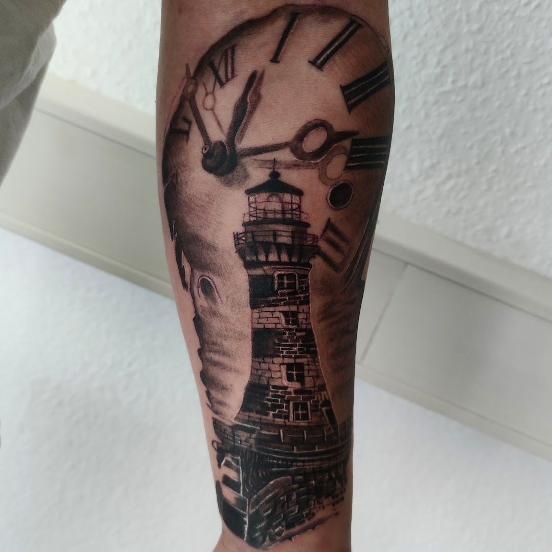 a lighthouse cover-up tattoo on the forearm, kreisfreie stadt heilbronn, germany