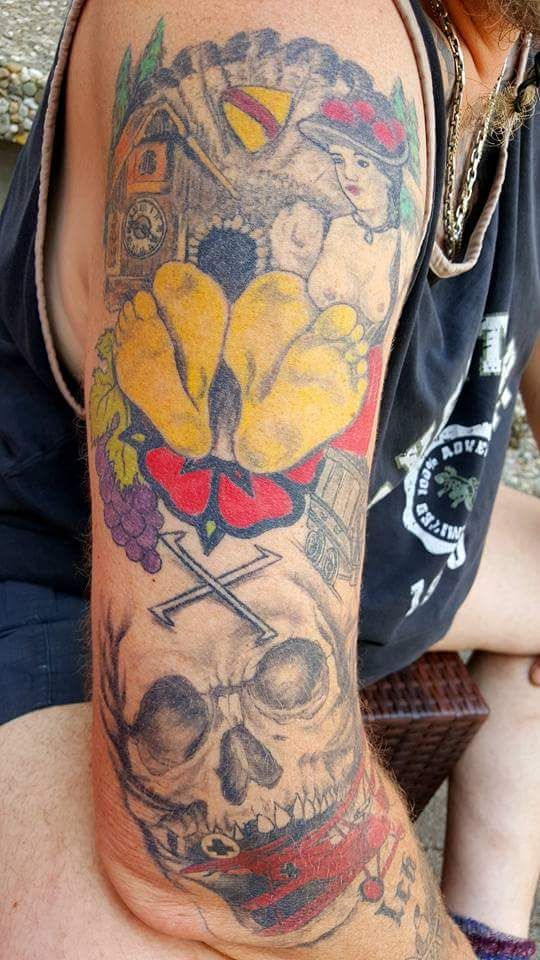 a man with a cover-up tattoo on his arm, rastatt, germany