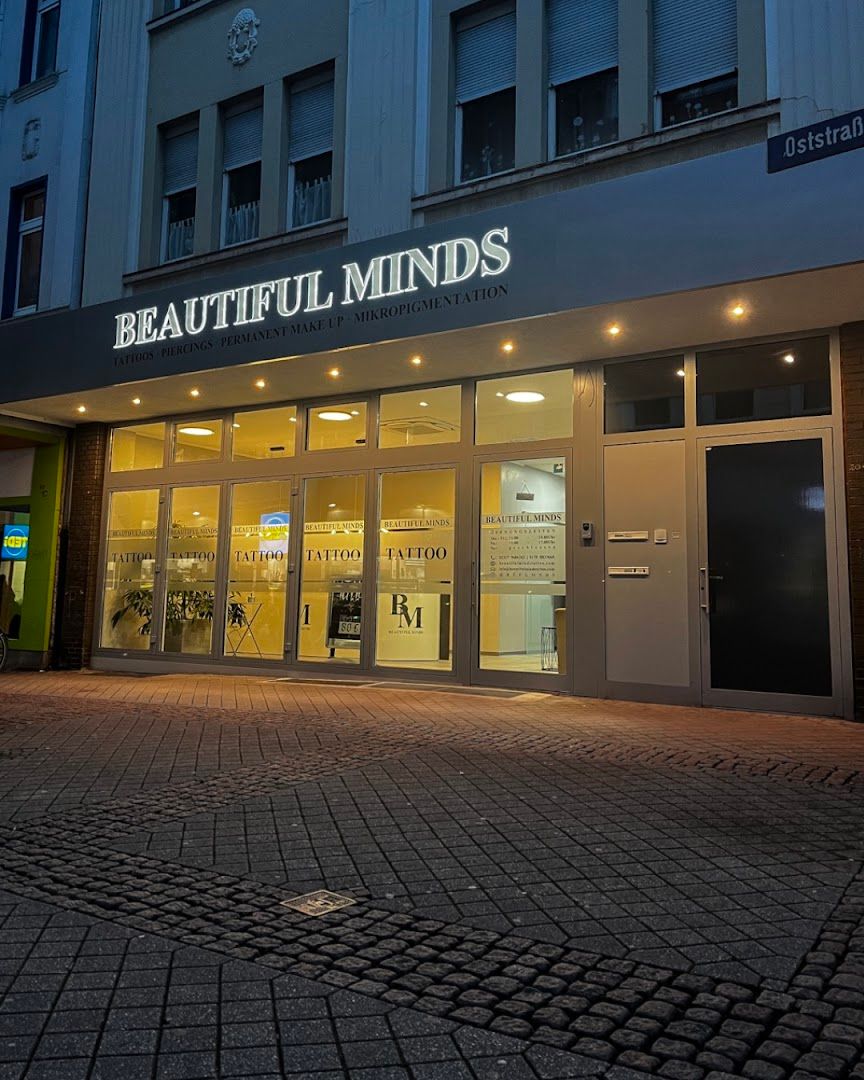 the front of a building with a sign that says beautiful minds