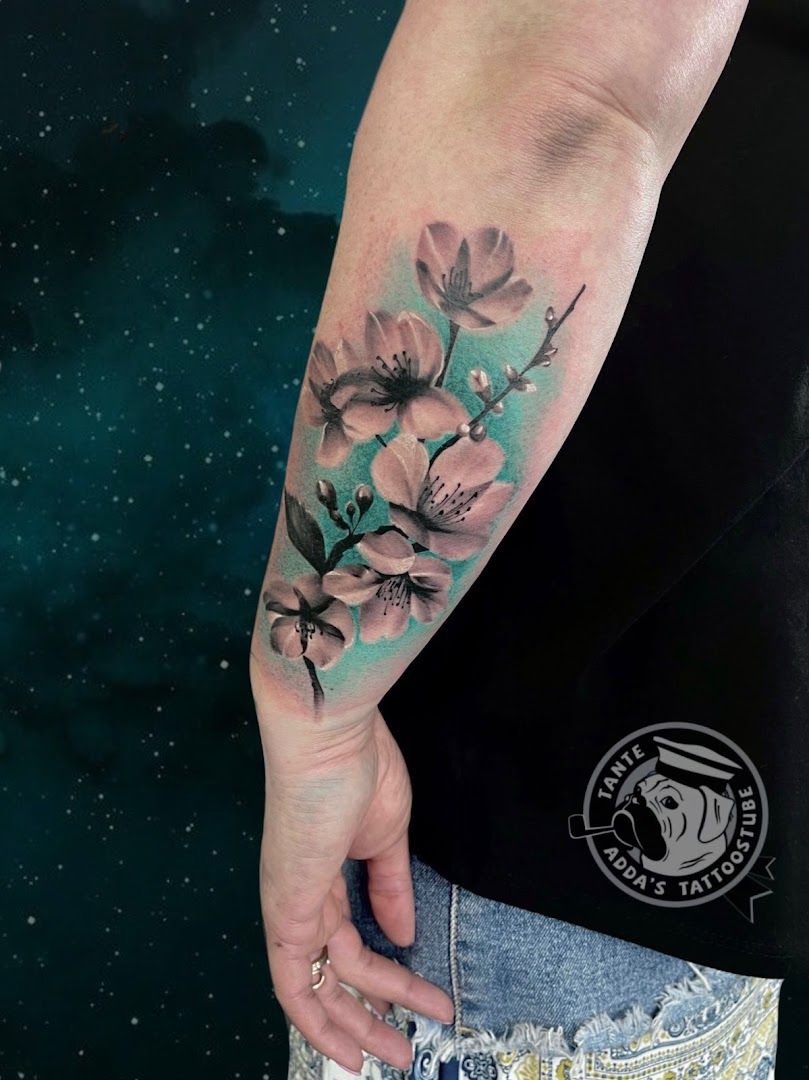 a woman's arm with a cover-up tattoo of flowers on it, bad kreuznach, germany