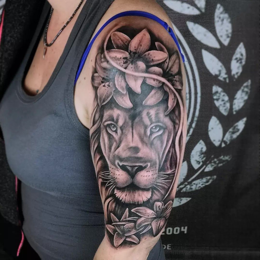 a woman with a lion japanische tattoos in leipzig on her arm, main-spessart, germany