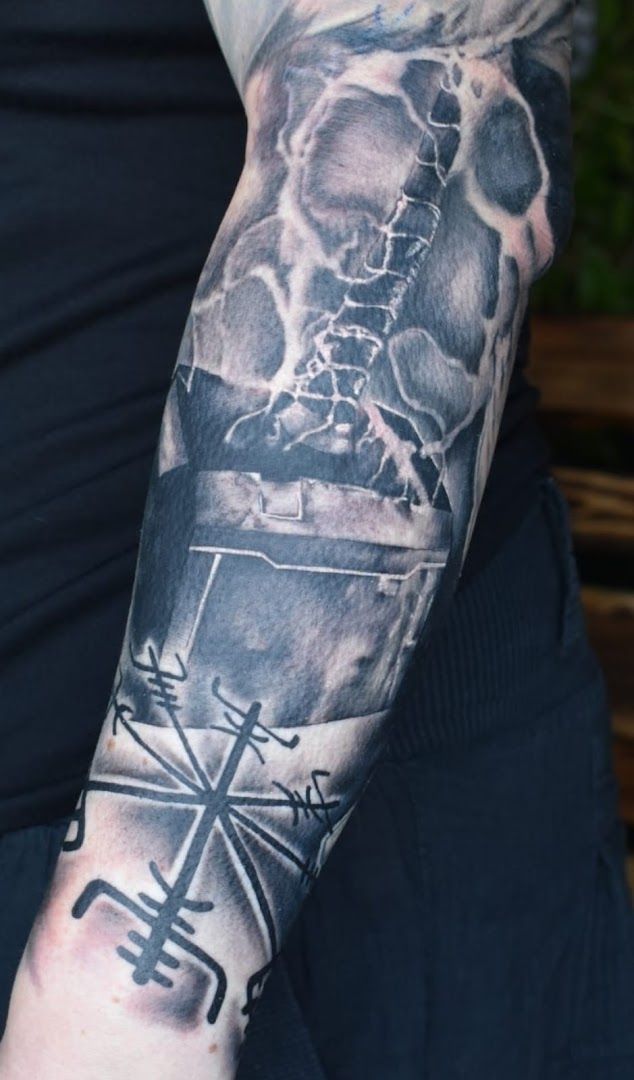 a man with a cover-up tattoo on his arm, helmstedt, germany