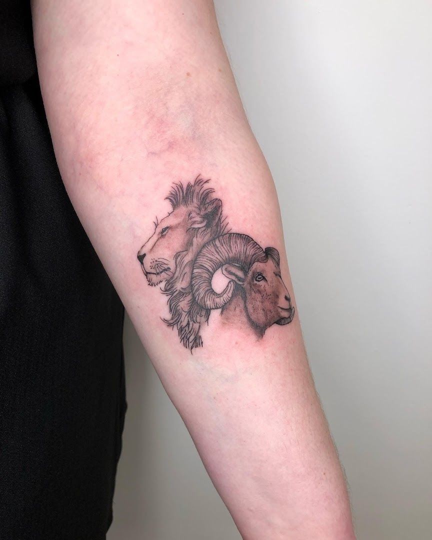 a narben tattoo of a lion on the arm, stuttgart, germany