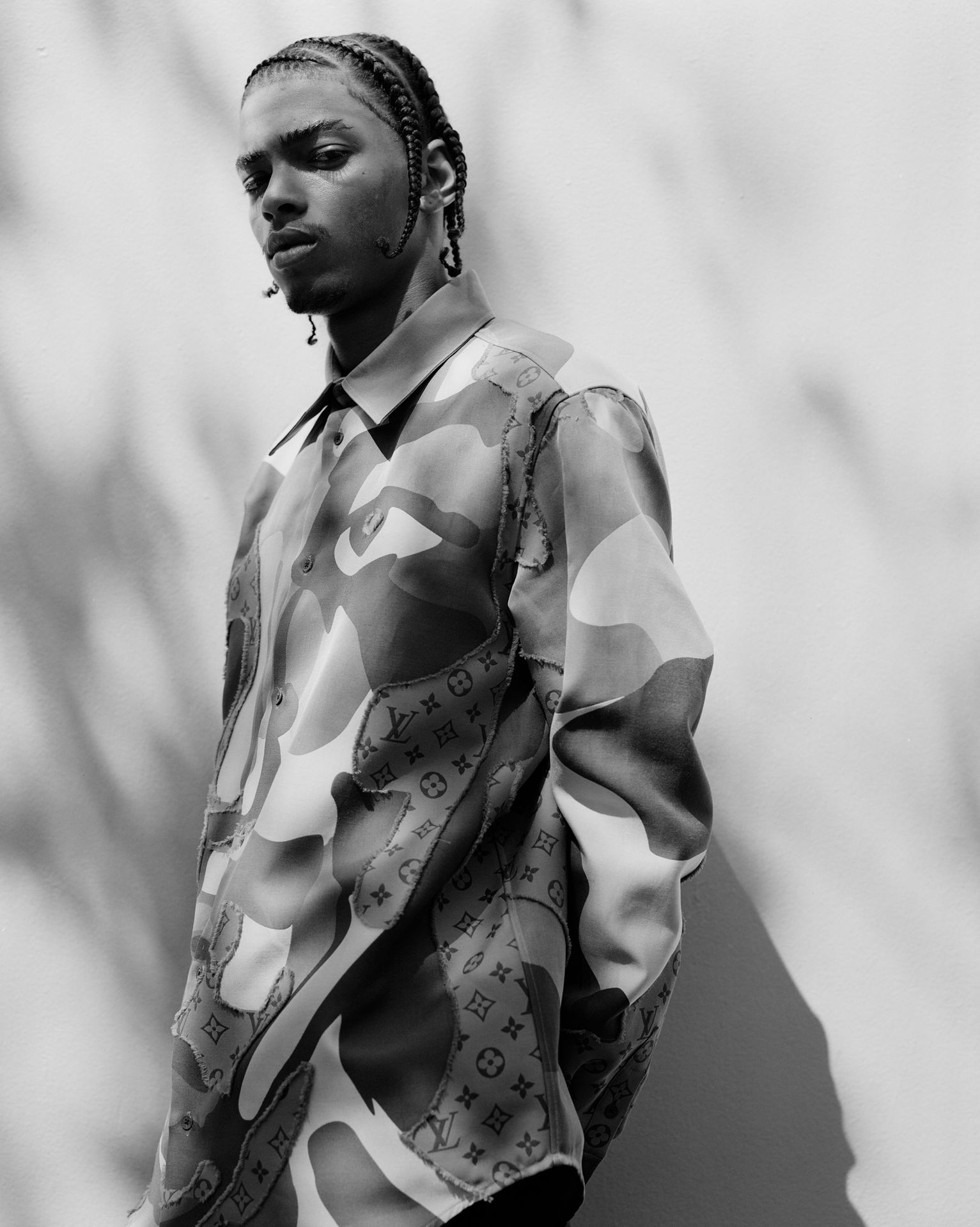 black and white image of man in a jacket