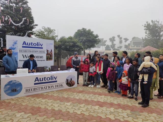 Guests arriving at the registration desk for a corporate outing on a winter morning — corporate team outing venue near Delhi