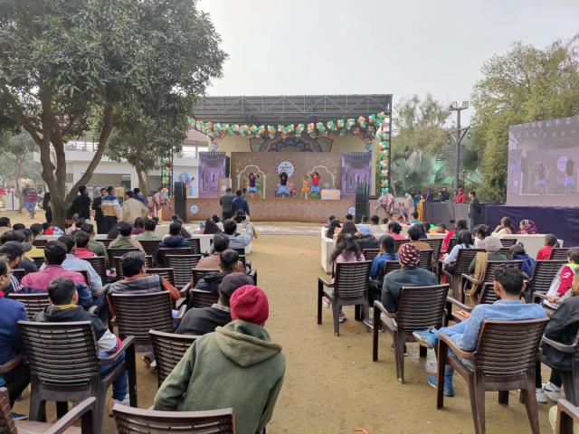Live cultural performance on the open-air stage at a corporate family day — corporate entertainment venue in Gurugram