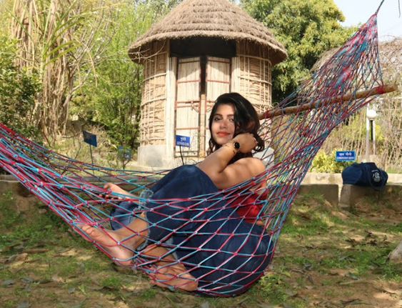 A guest relaxing in a hammock at Rangmanch Farms