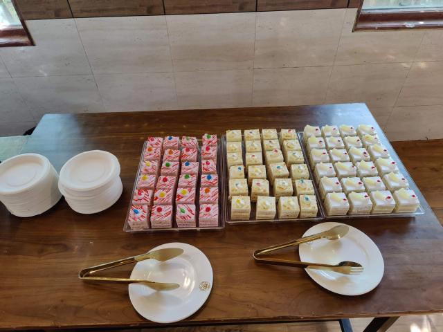 Trays of pastries on the dessert counter at a corporate event — corporate outing catering near Delhi, Rangmanch Farms