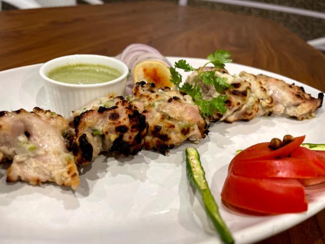 Grilled kebab starters served with green chutney, onion and tomato garnish at Rangmanch Farms, an event and dining venue in Gurugram near Delhi