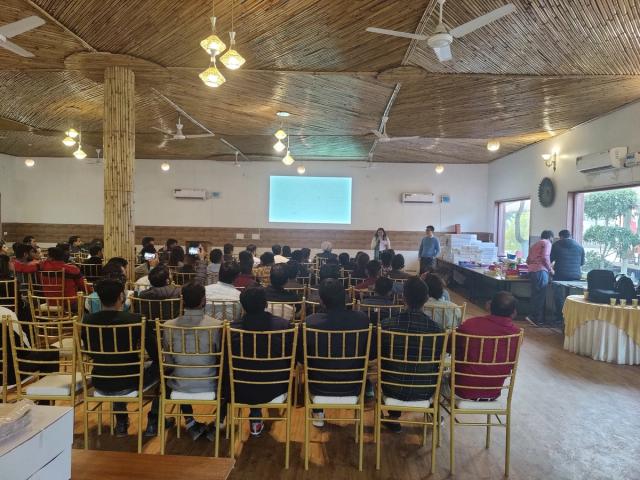 Indoor air-conditioned hall with projector set up for a corporate training session — conference and offsite venue in Gurugram