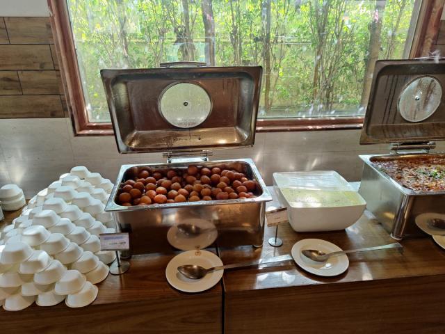 Warm Indian desserts on the sweet counter at a corporate buffet — corporate event catering at Rangmanch Farms, Gurugram