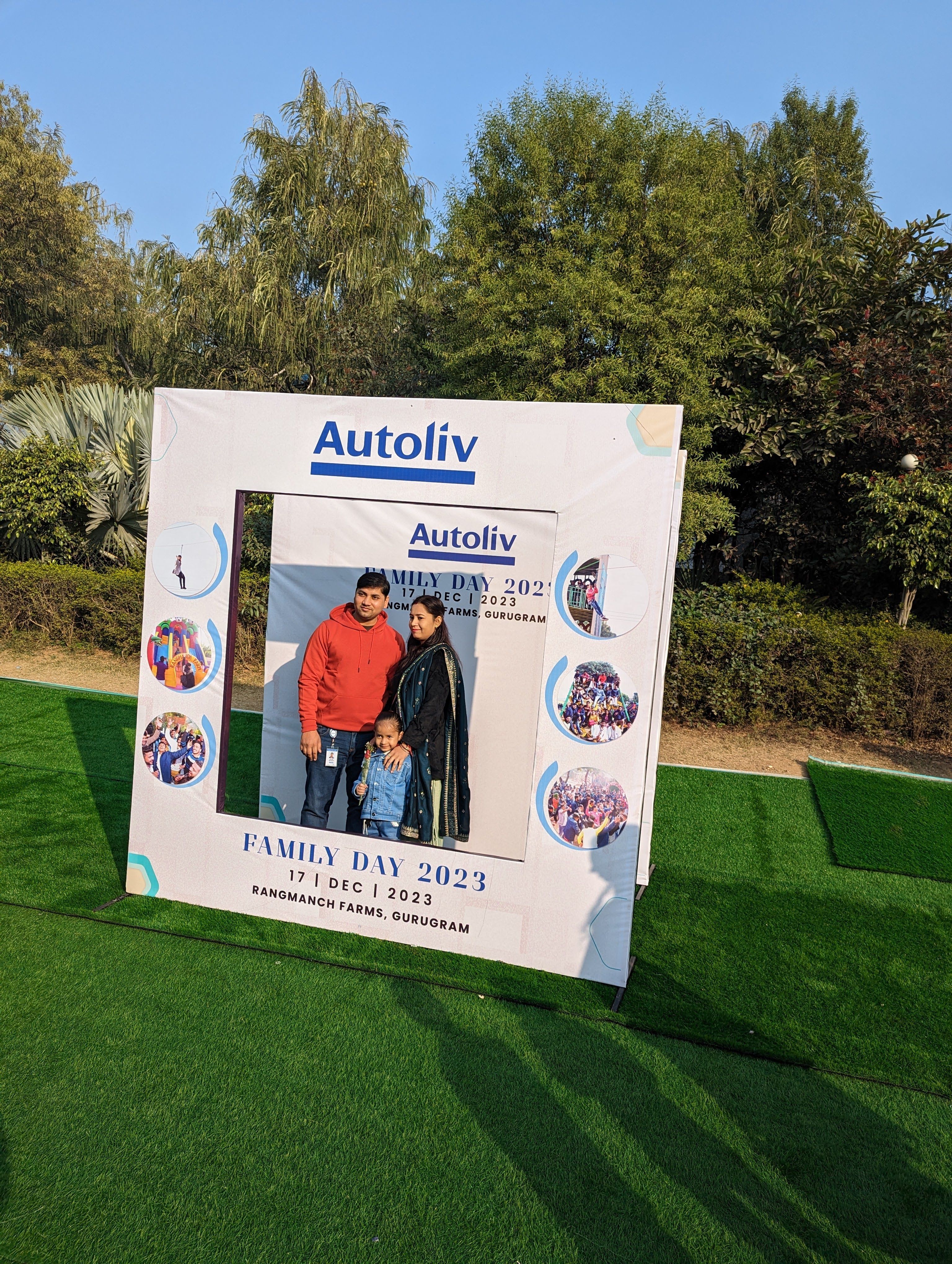 A family posing at the photo booth during a corporate family day — corporate family outing venue near Delhi, Gurugram