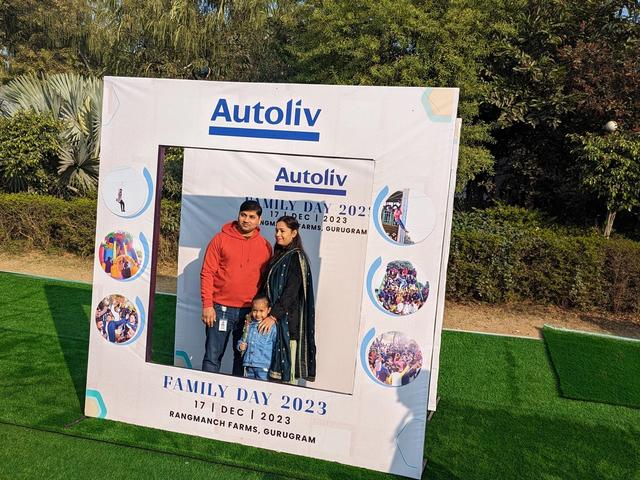 A family posing at the photo booth during a corporate family day — corporate family outing venue near Delhi, Gurugram