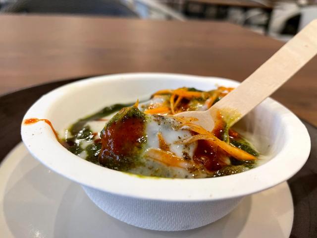 A bowl of chaat topped with curd, tamarind and green chutney at the chaat counter during an event at Rangmanch Farms, Gurugram near Delhi
