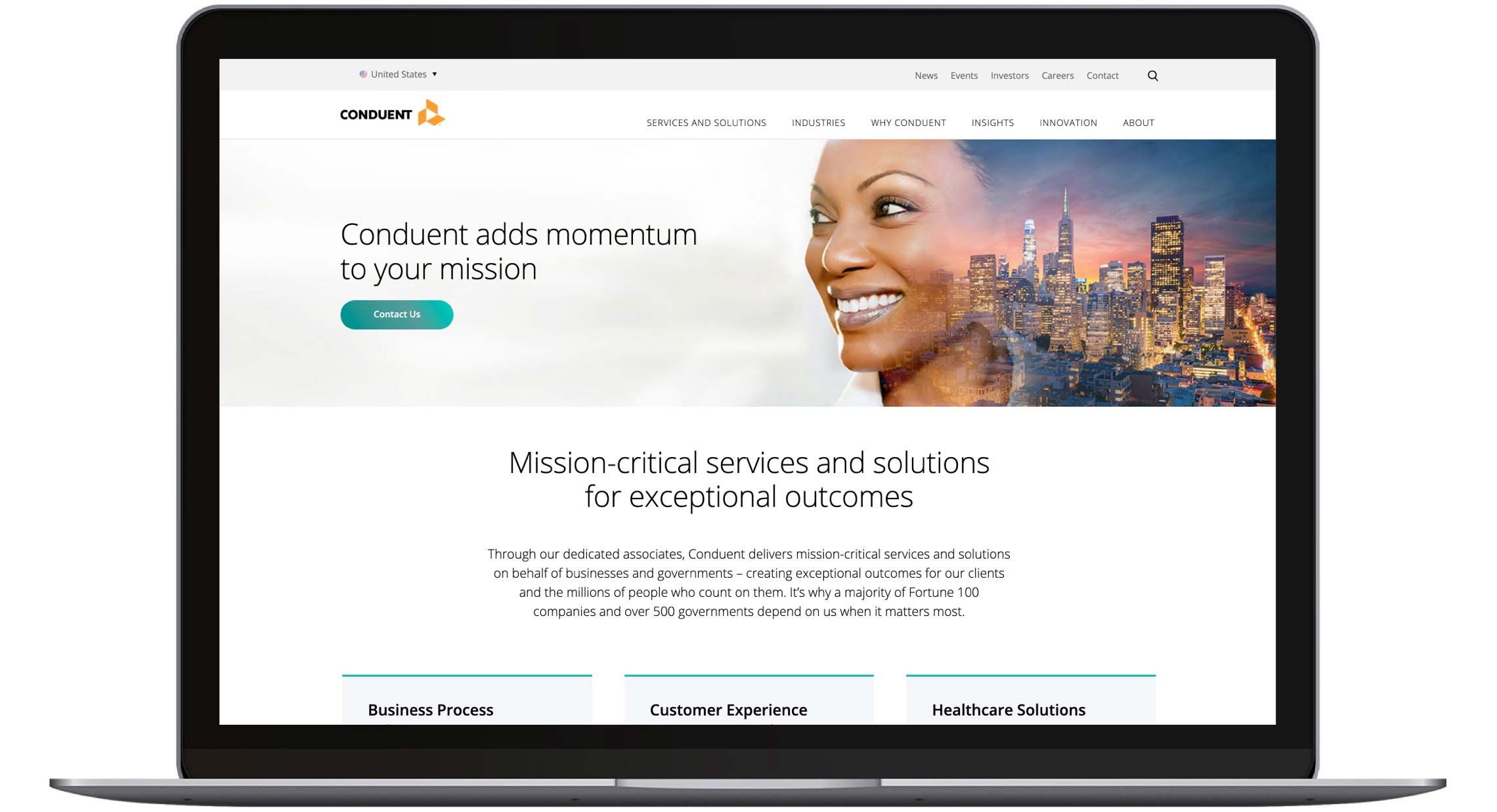 Photograph of a laptop displaying the Conduent Website.