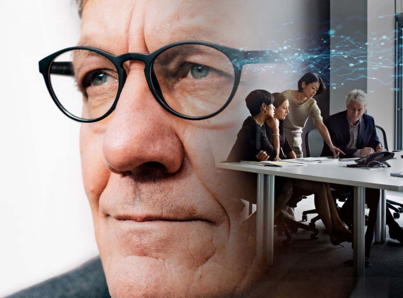 Business people meeting in an office. Also a sort of creepy-looking old white man superimposed on top. Probably the boss. I'm uncomfortable.