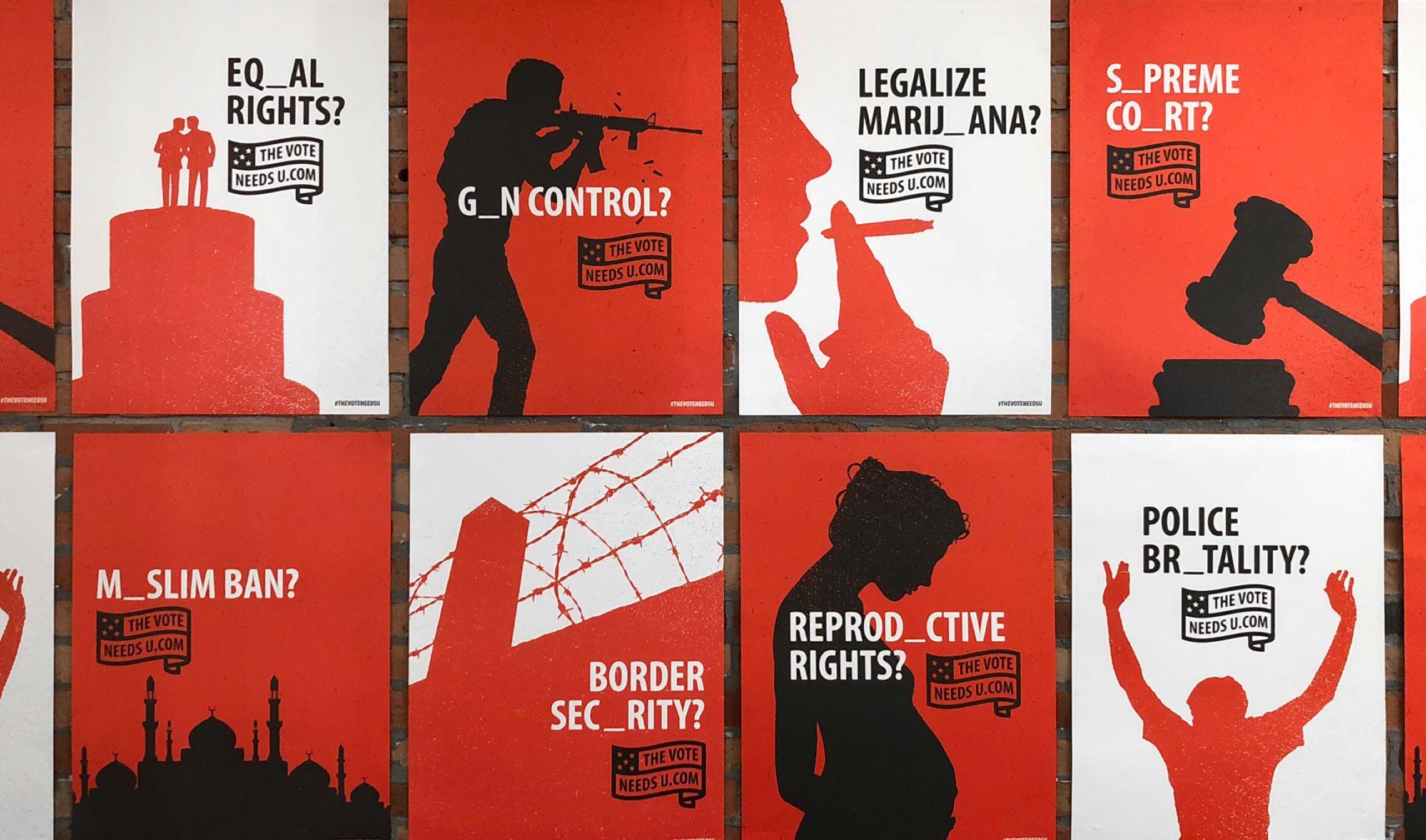 Multiple posters on a wall.