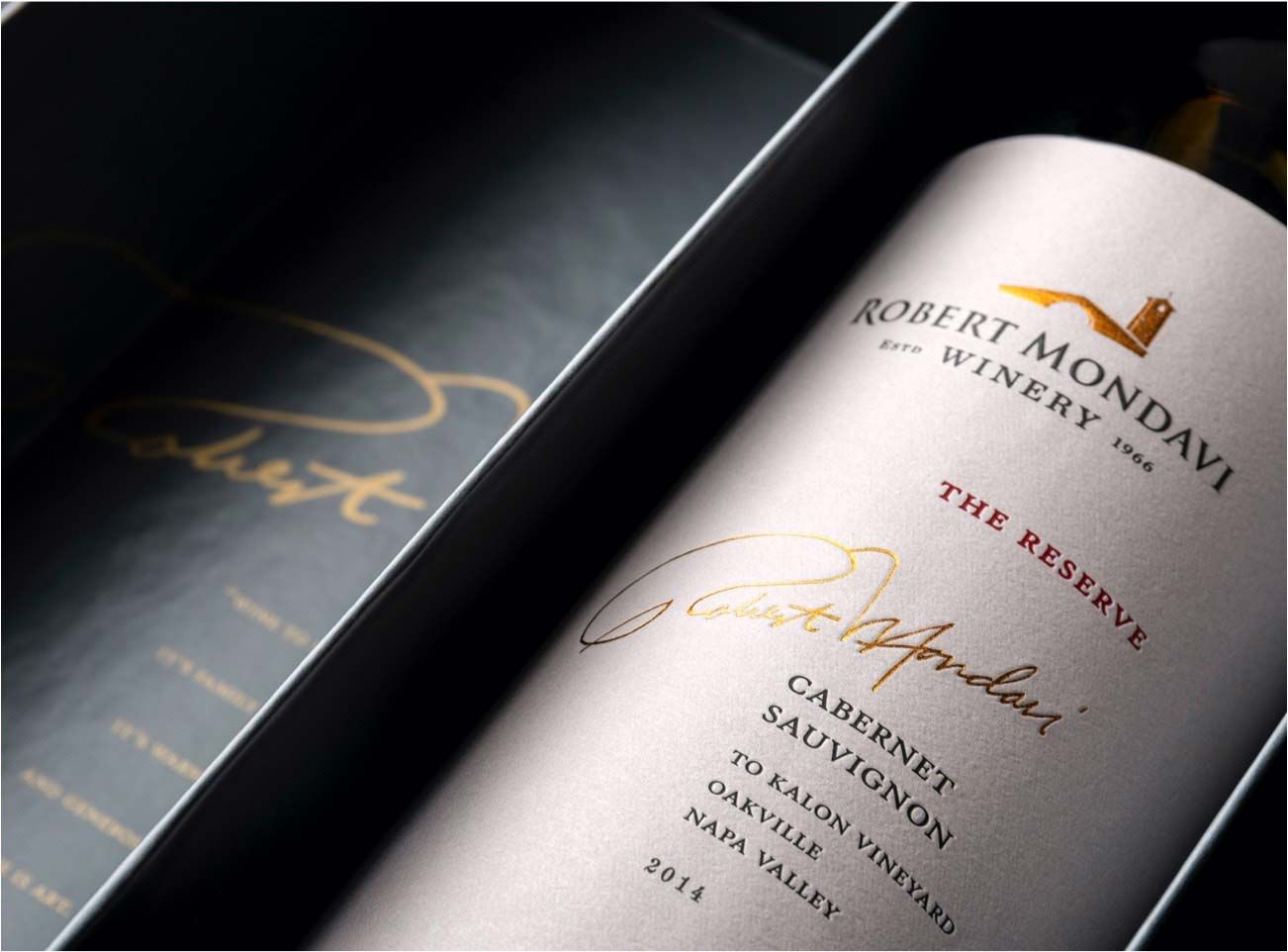 Stylish photograph of a Robert Mondavi wine bottle in a box.