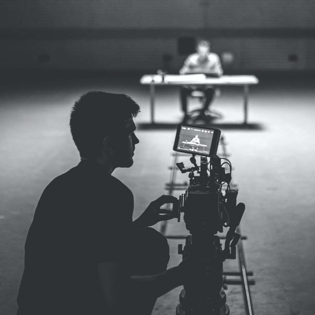 Photograph of a P+N employee filming an advertisement.