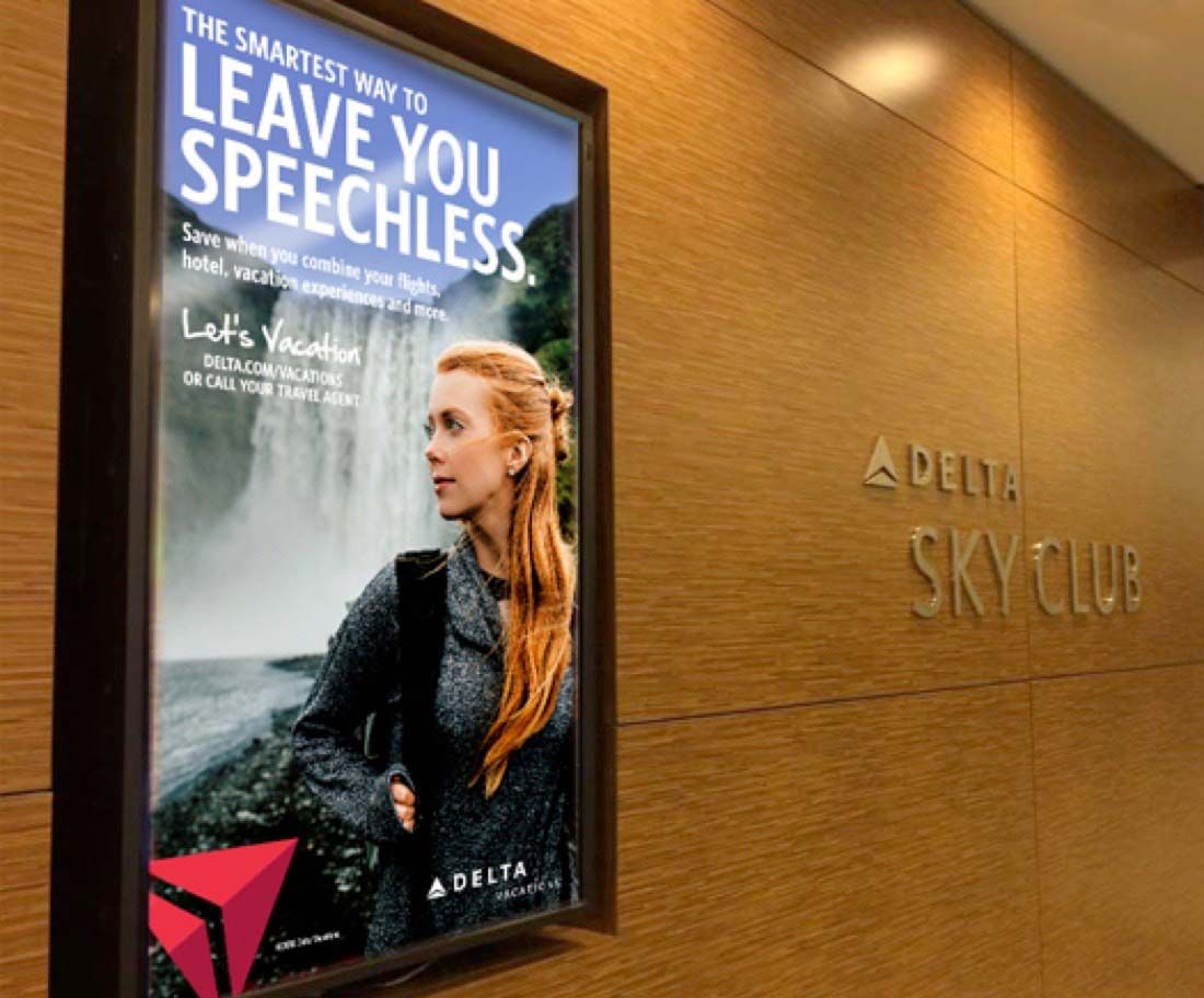Delta Vacations poster in the Delta Sky Club.
