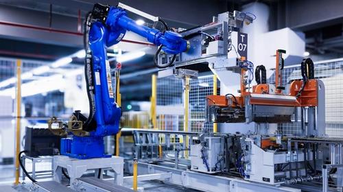 Industrial robot arm under blue light