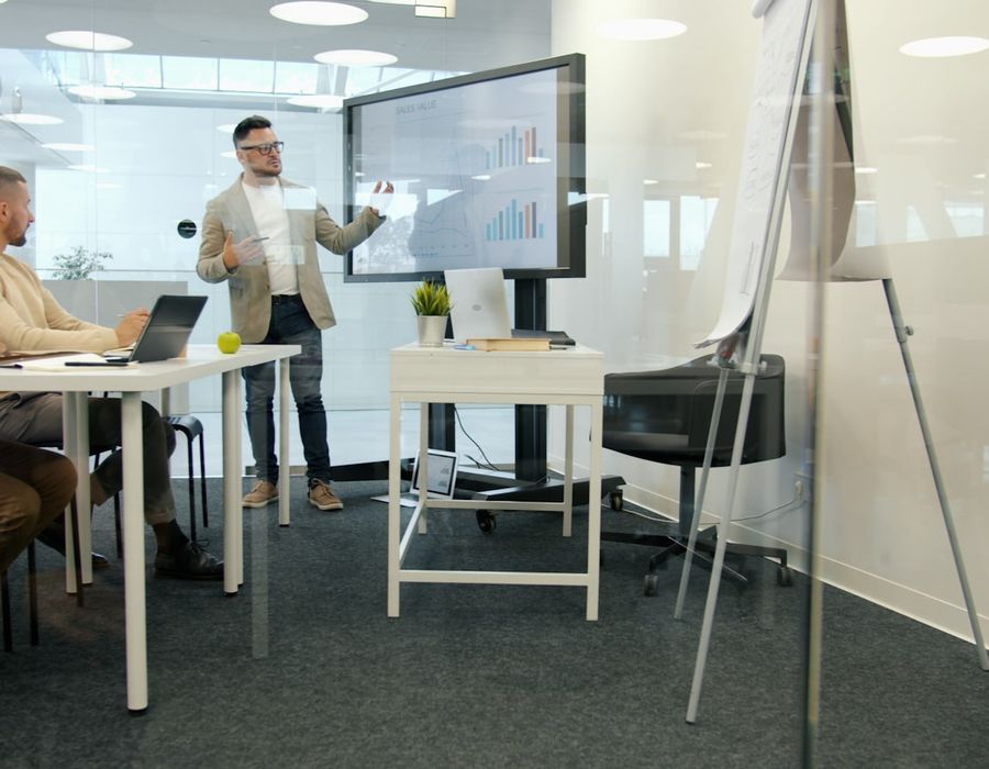 Executive presenting to a seated leadership group