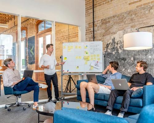 Delivery team working through a session at a whiteboard