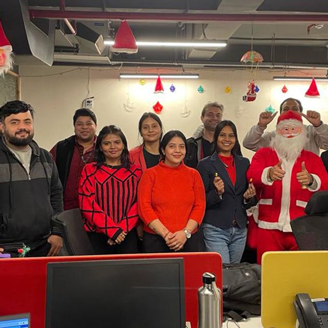 The team at their desks during Inspira's decorated Christmas celebration