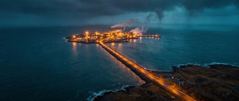 A petrochemical refinery lit at blue hour
