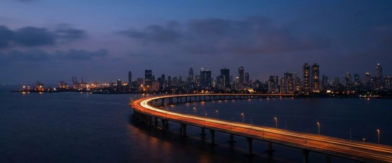 The Mumbai skyline at twilight across the harbour