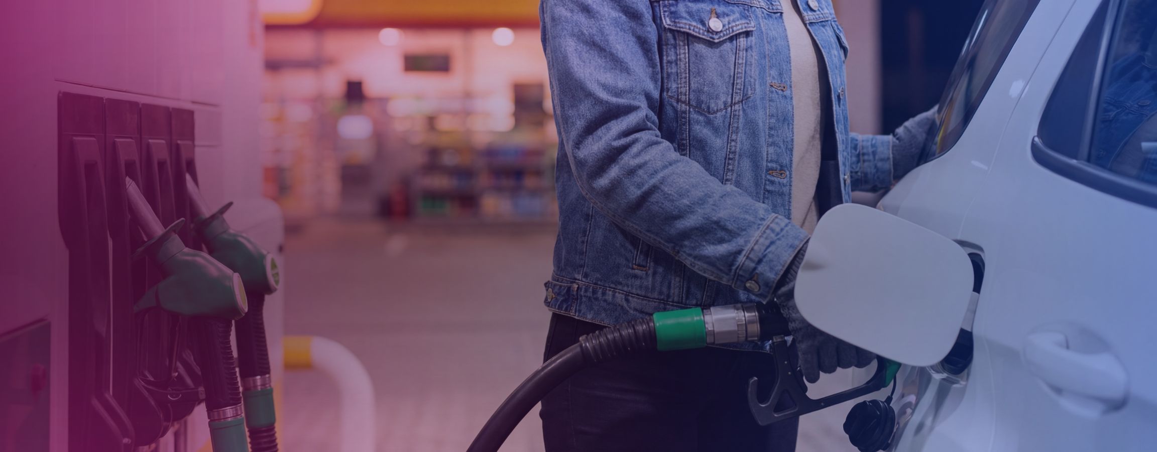person filling up their car with fuel