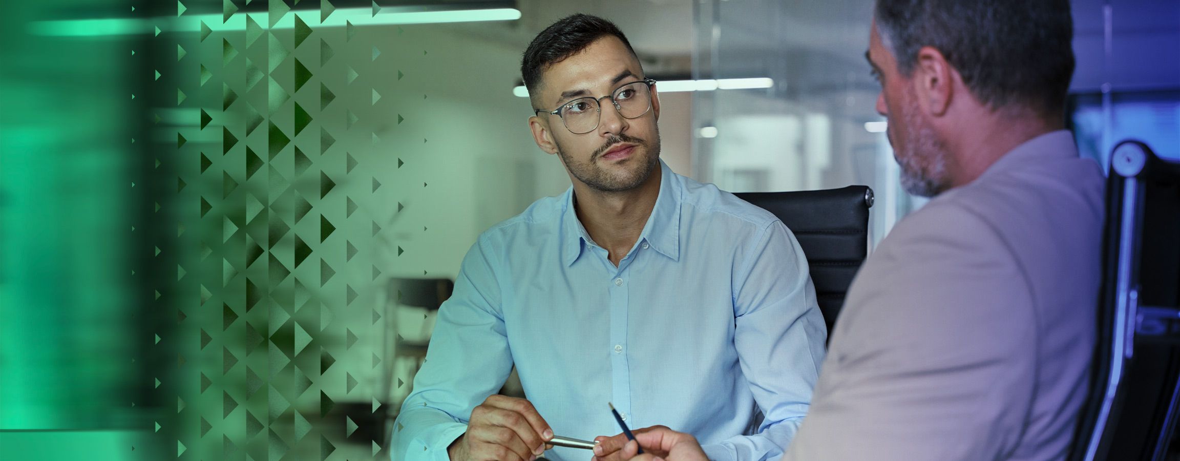 Two men talking over a table