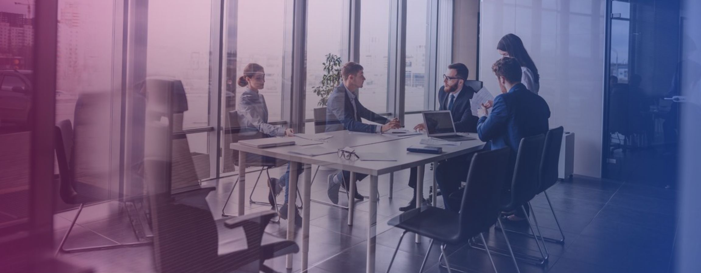 Stock image of employees in a meeting