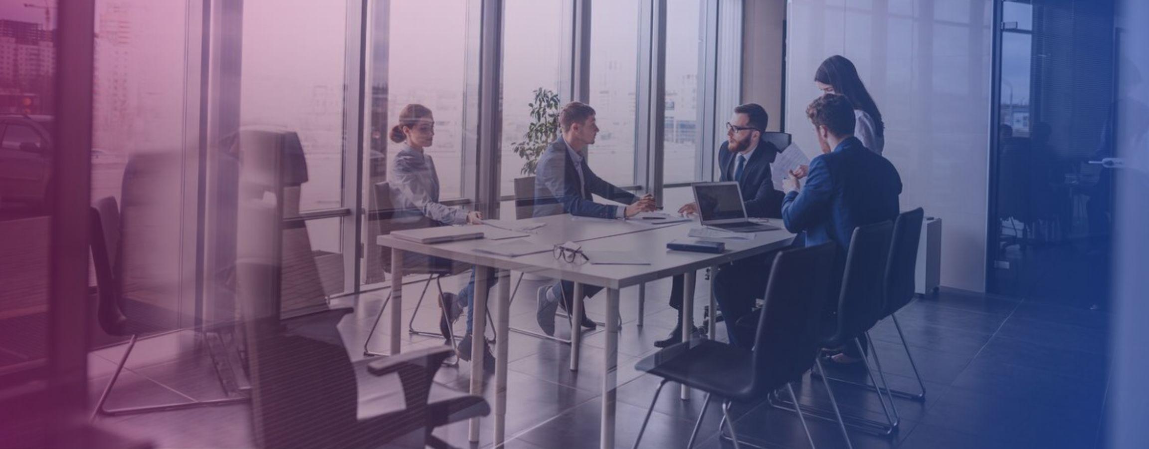 Stock image of employees in a meeting