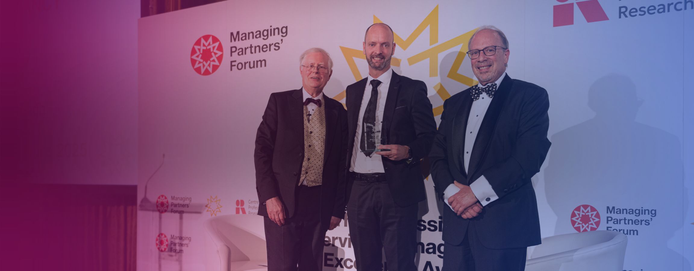 Azets UK CEO accepting an award