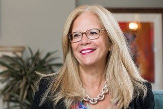 A headshot of Melanie Richards CBE