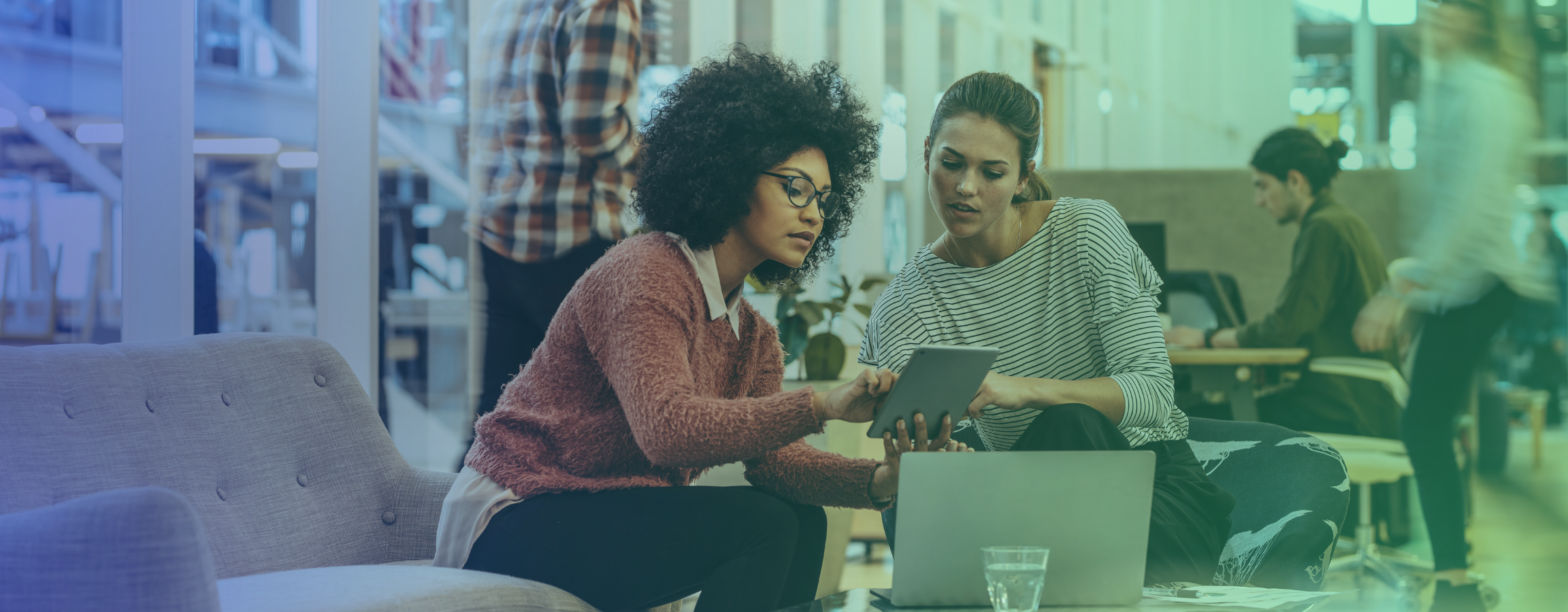 A stock image of two women looking at a tablet