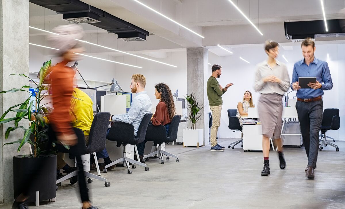 People walking in a busy office