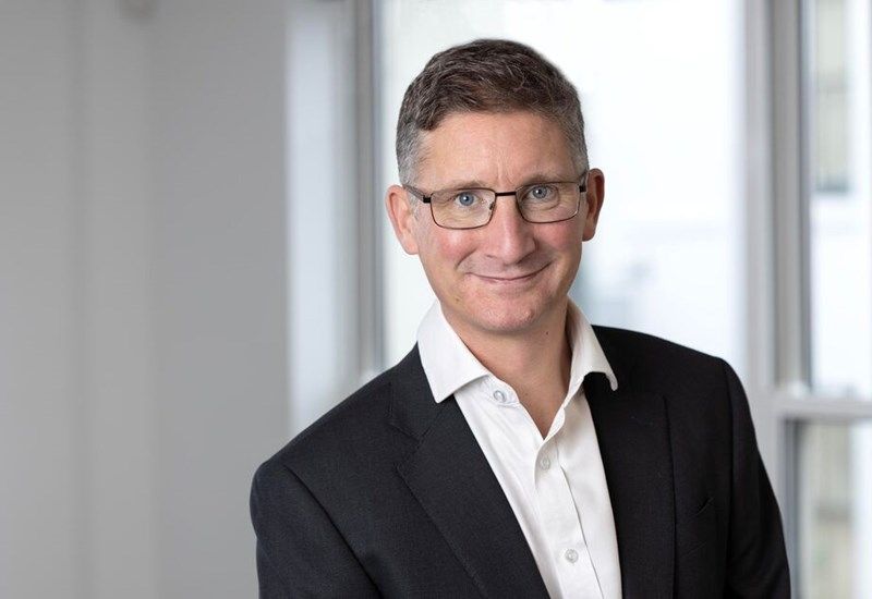 A headshot of Neil Elsden