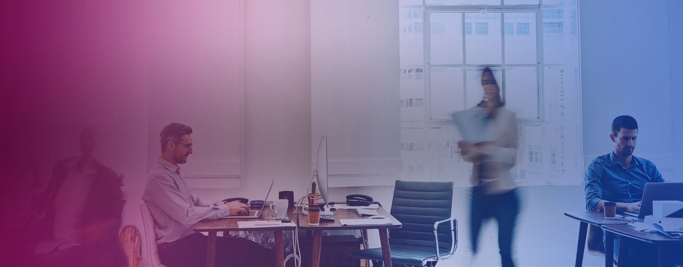 A stock image of people working in an office
