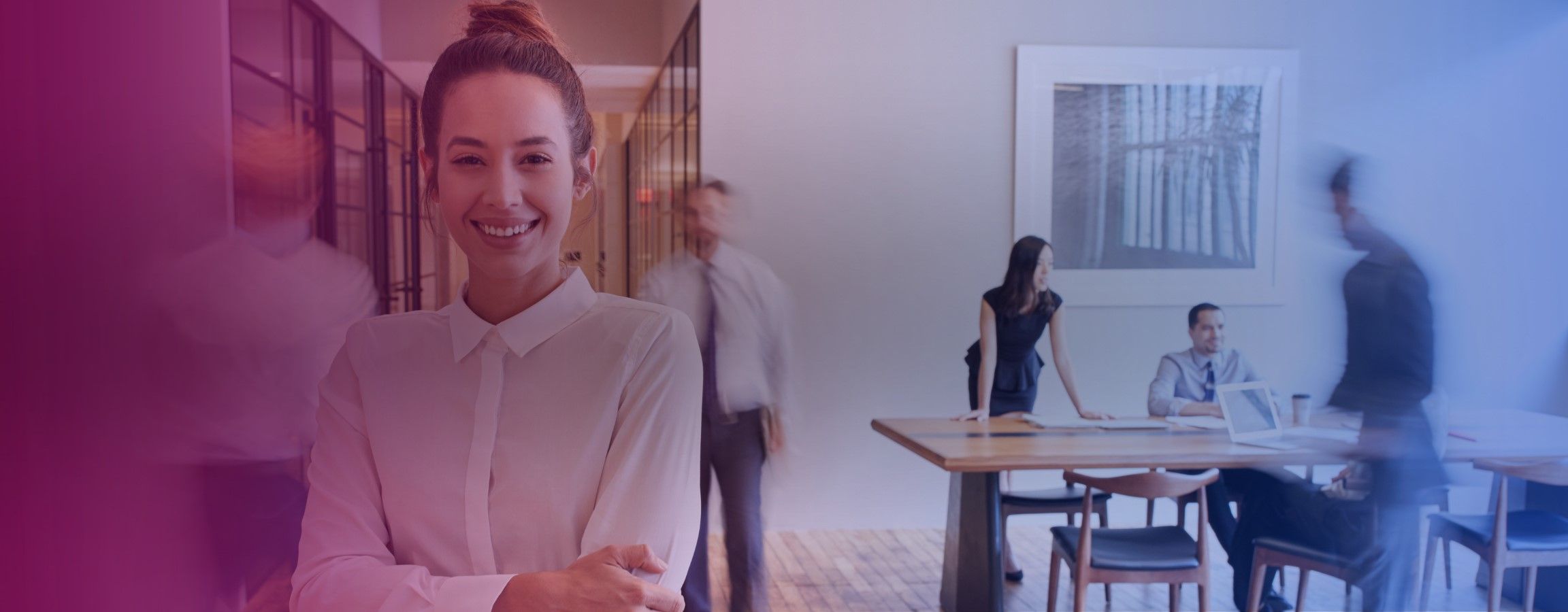 Office stock image with an employee smiling at the camera