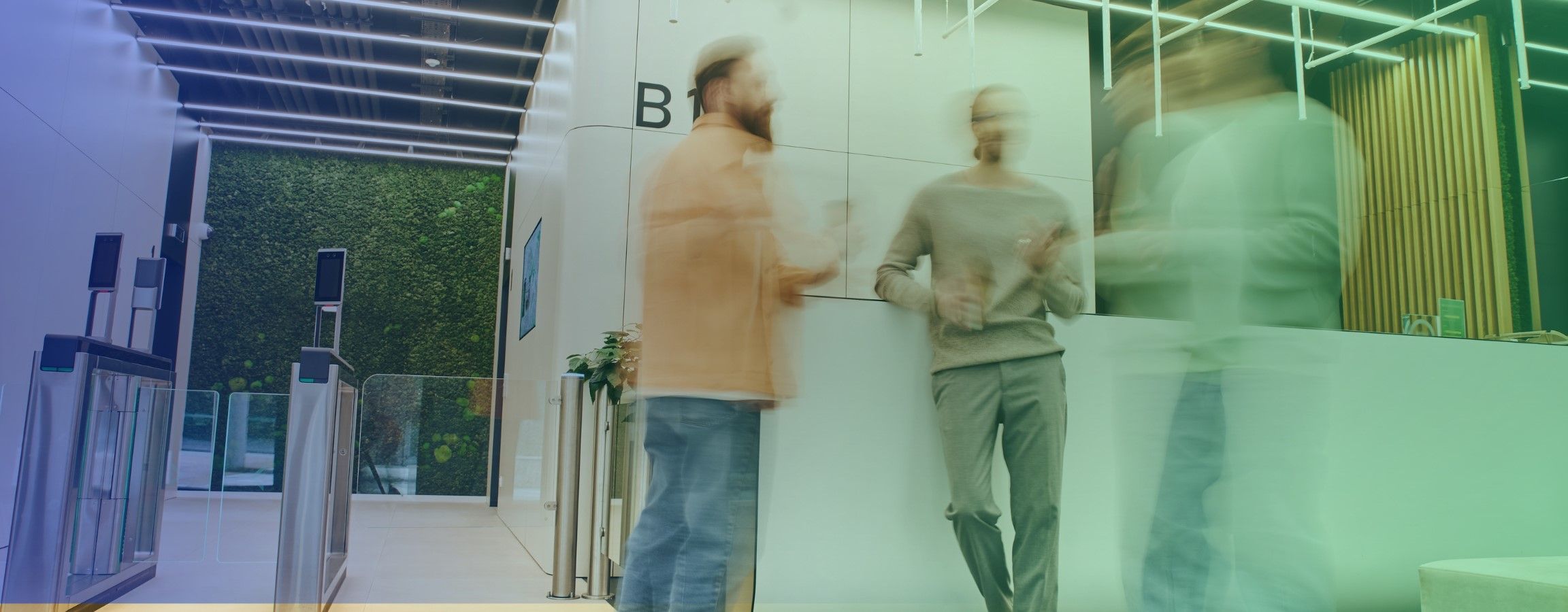 Stock image of employees conversing in an office